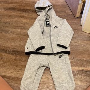 18m Nike grey Nike tech . In good condition zipper piece is broke